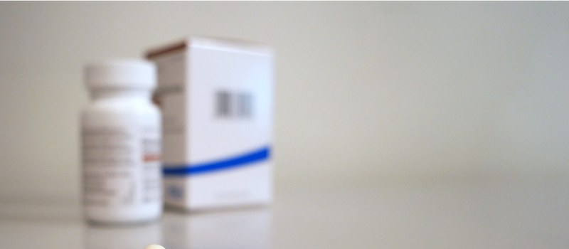 Prescription medication packaging on a clean counter.